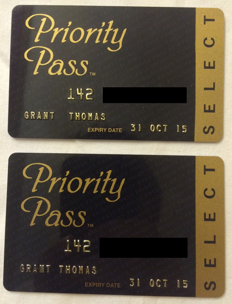 a pair of black and gold credit cards
