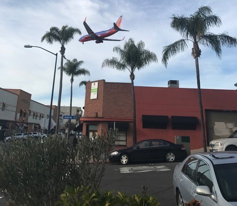 a plane flying over a building