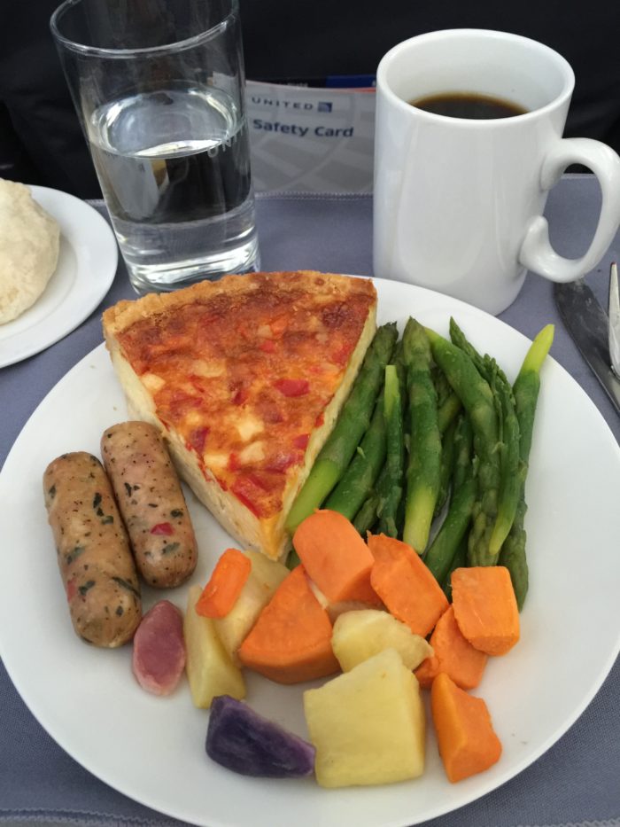 a plate of food and a mug of coffee