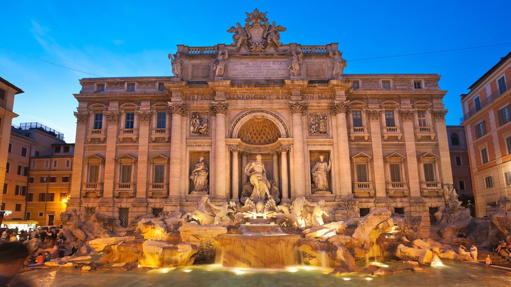 a large stone building with a fountain and statues with Trevi Fountain in the background