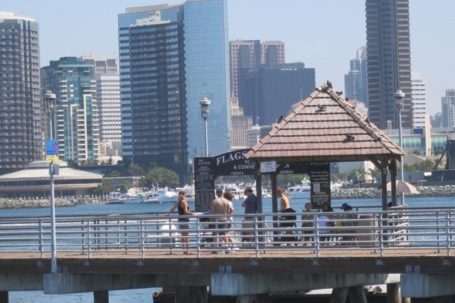 a group of people on a pier