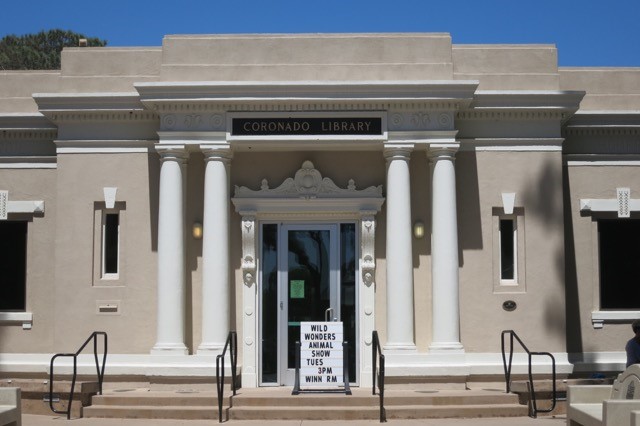 a building with columns and a sign
