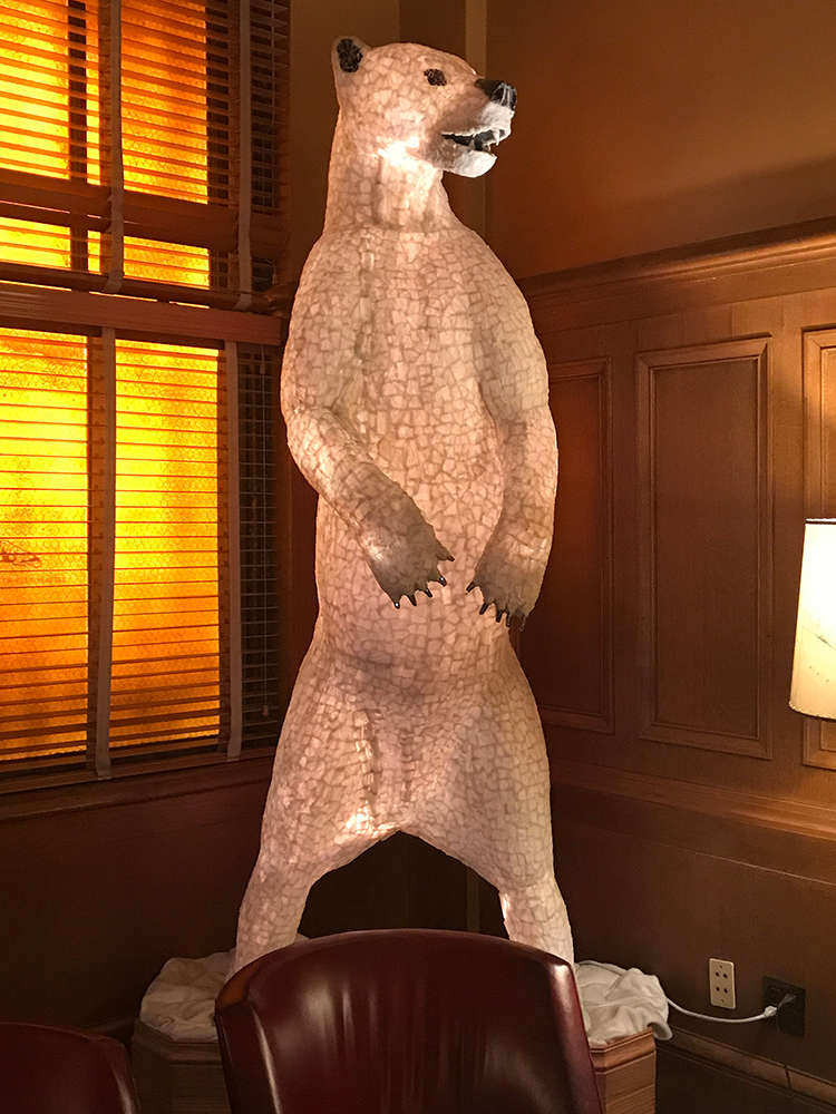 a statue of a bear in a room