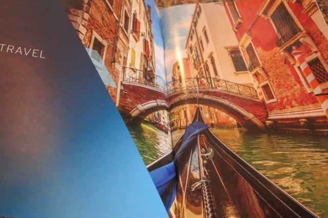 a book open to a picture of a canal