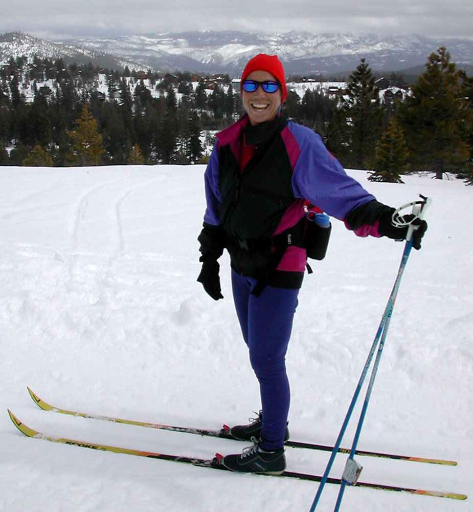 a woman on skis smiling
