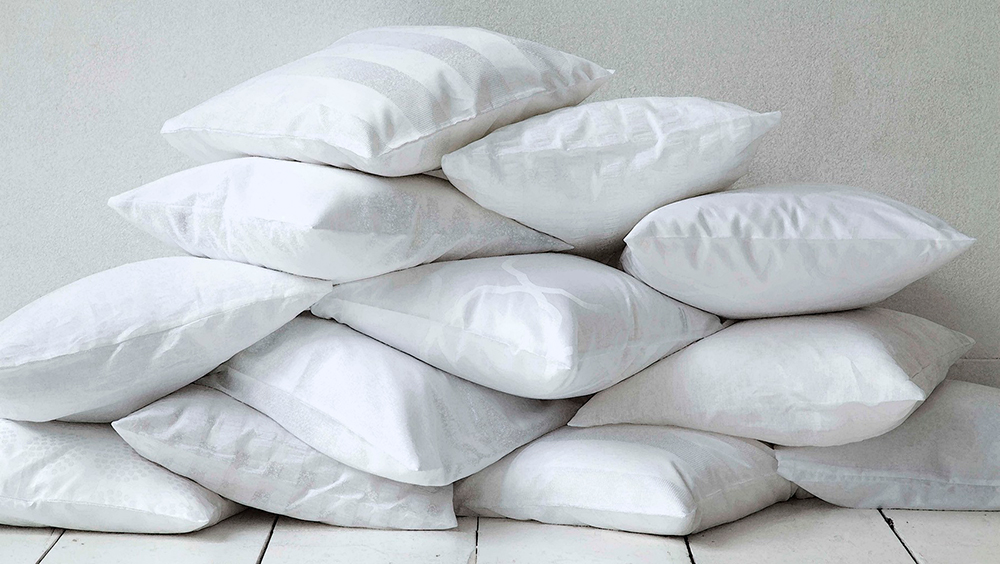 a stack of white pillows