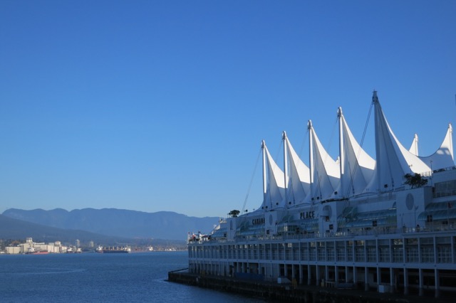 a large white building with sails on top