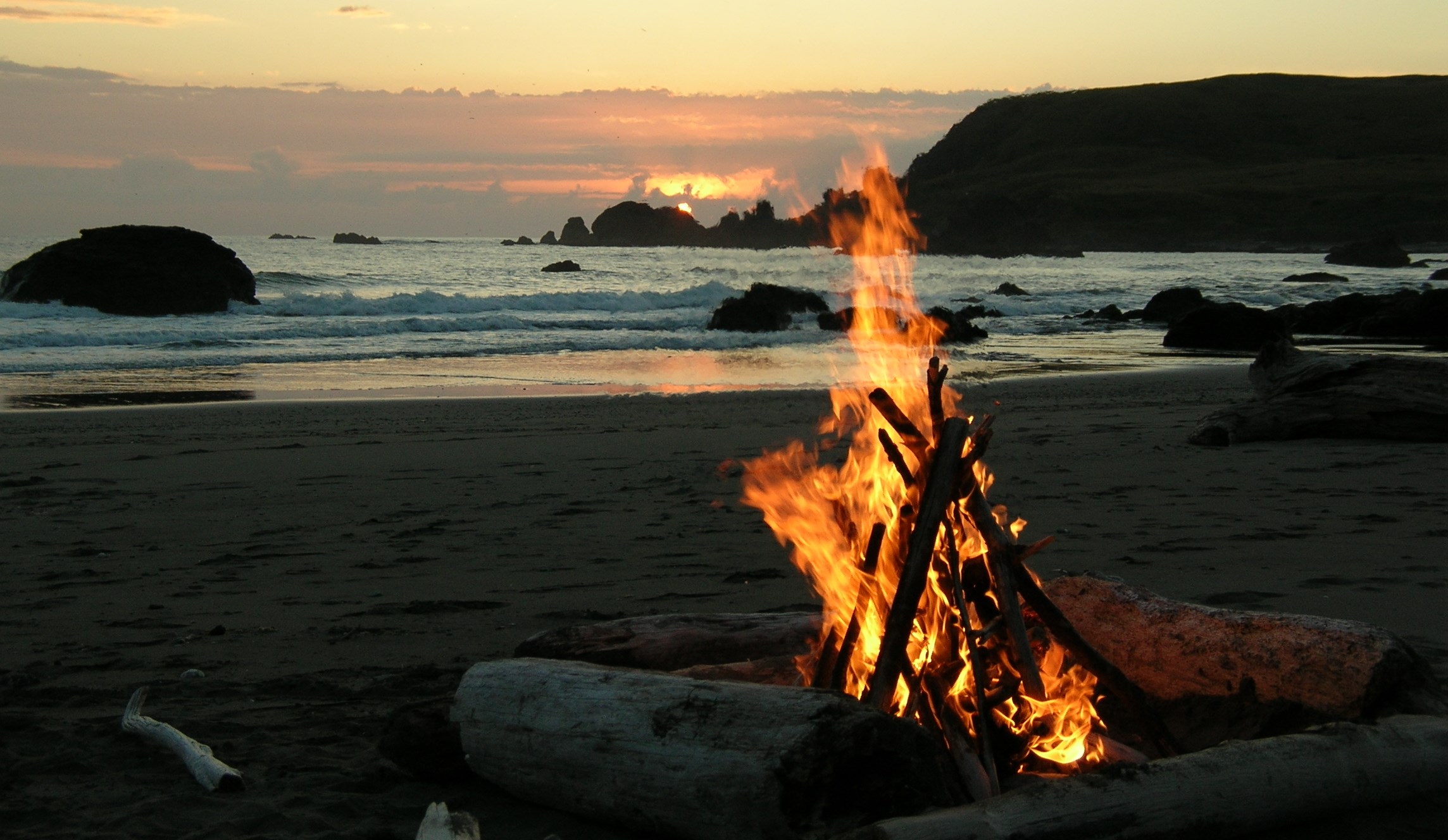 a bonfire on a beach