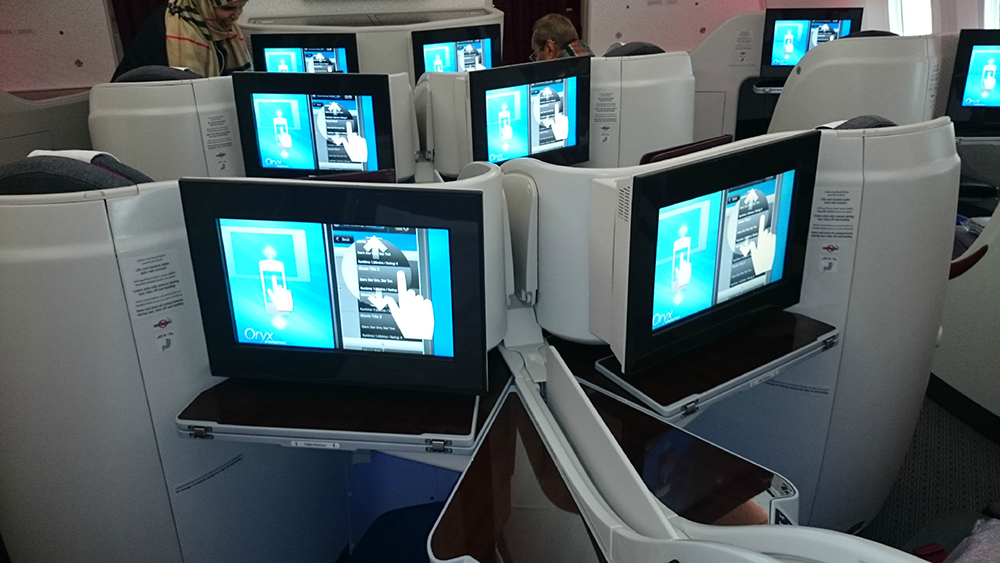 a group of computer monitors