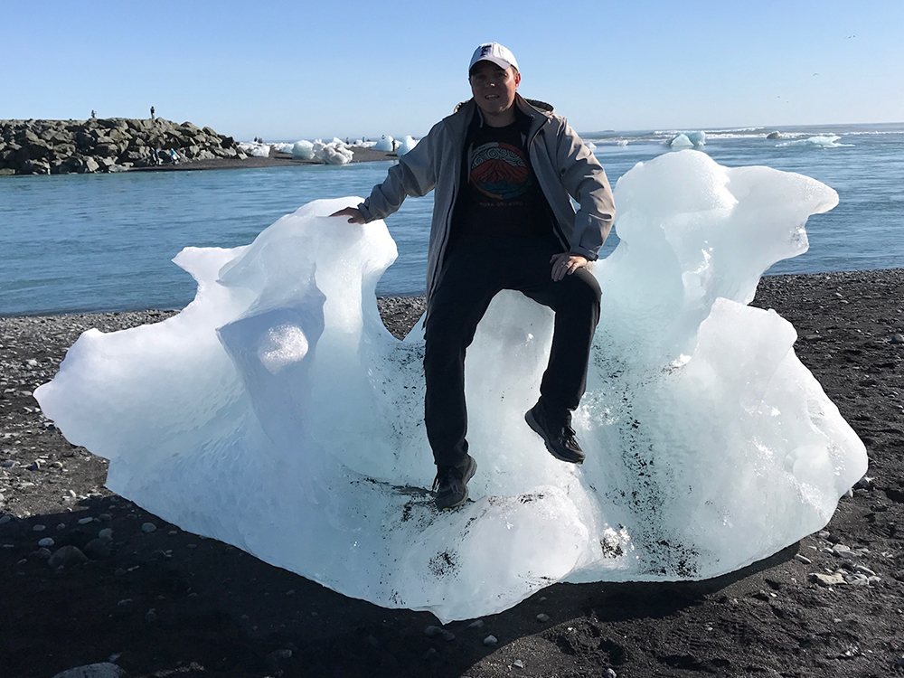 a man sitting on an iceberg