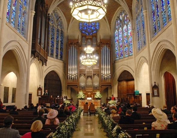 a church with many people sitting in pews