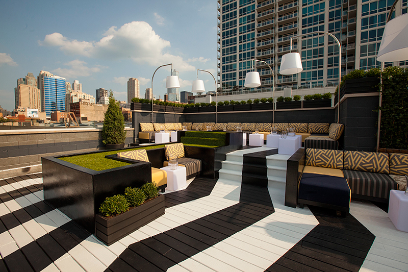 a rooftop patio with a black and white striped floor