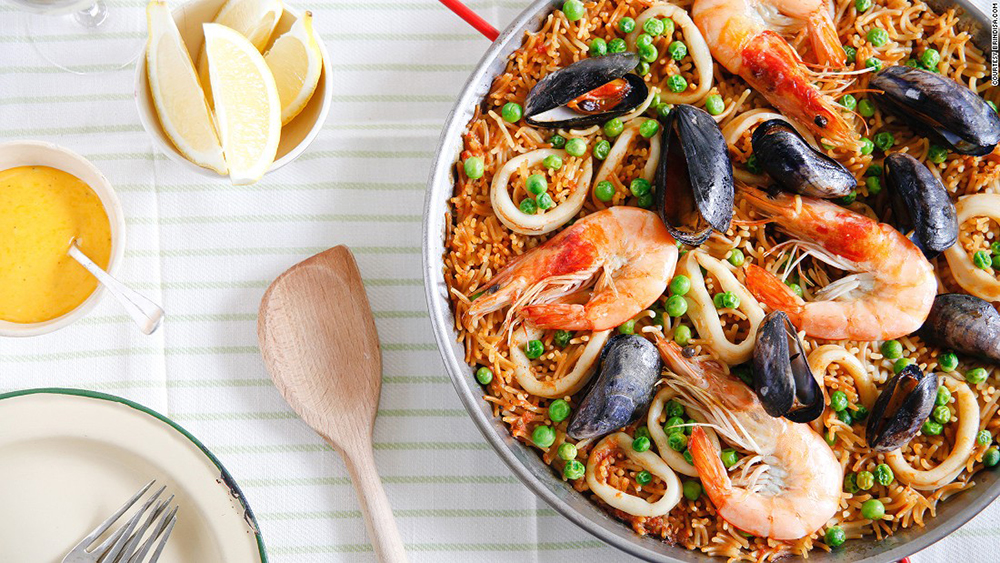 a pan of seafood rice and mussels