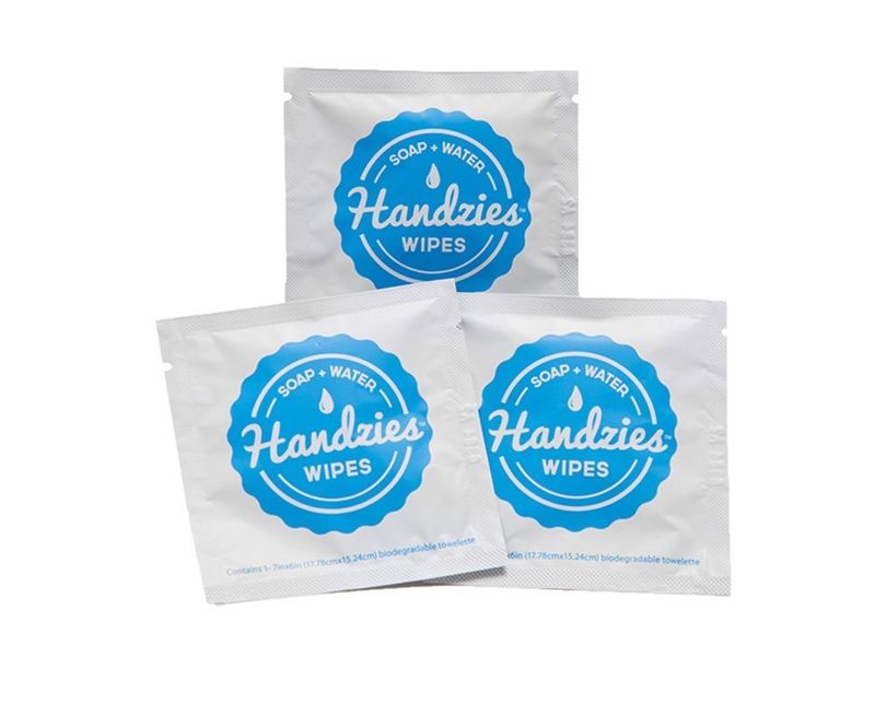 a group of white and blue packages of wipes