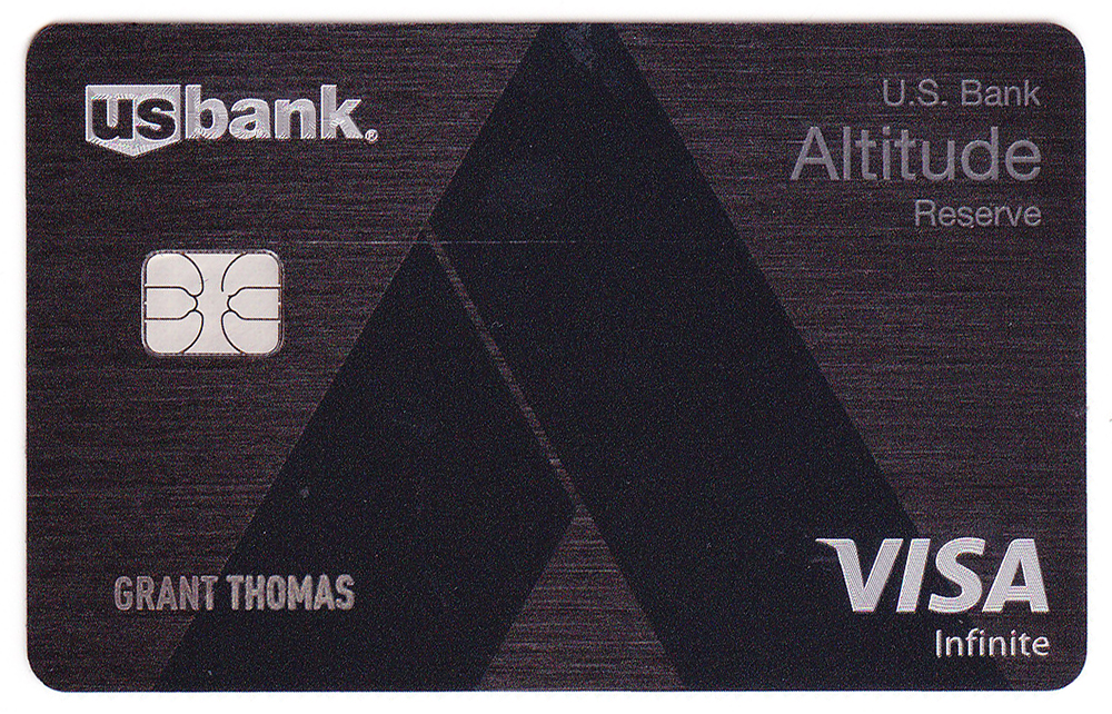 a credit card with a black and silver design