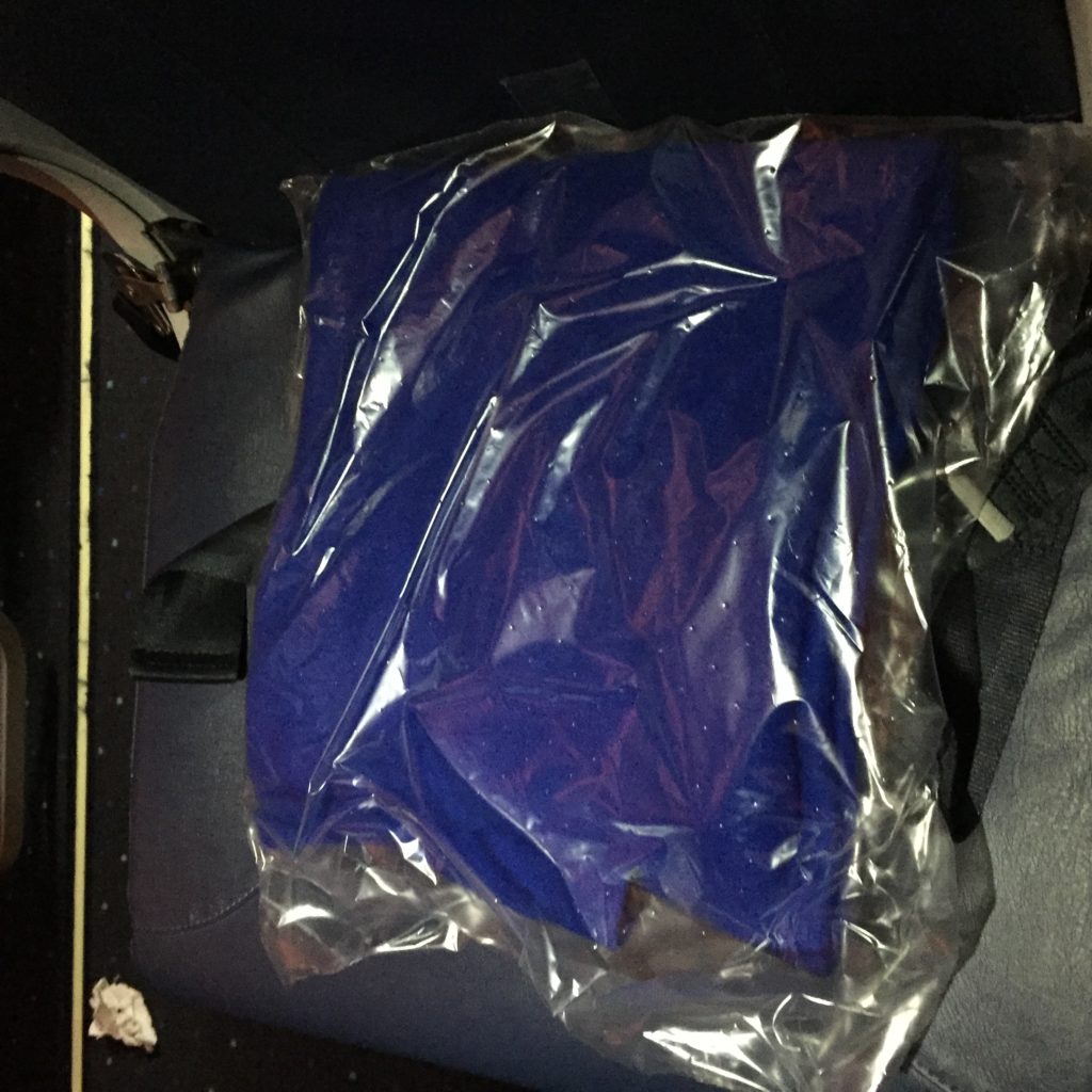 a blue shirt in a plastic bag
