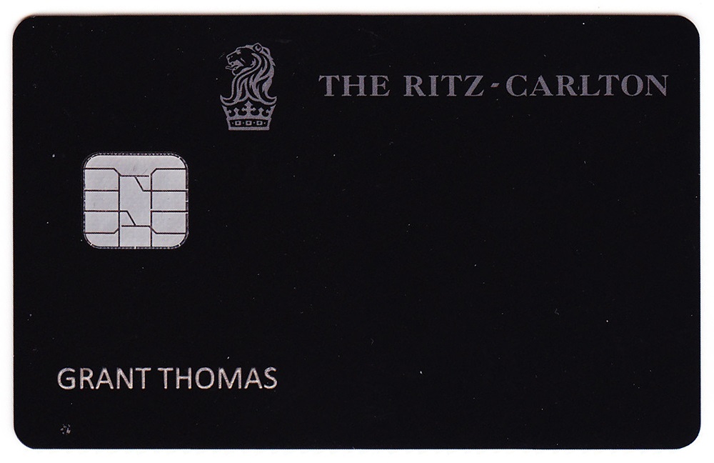 a black credit card with a chip