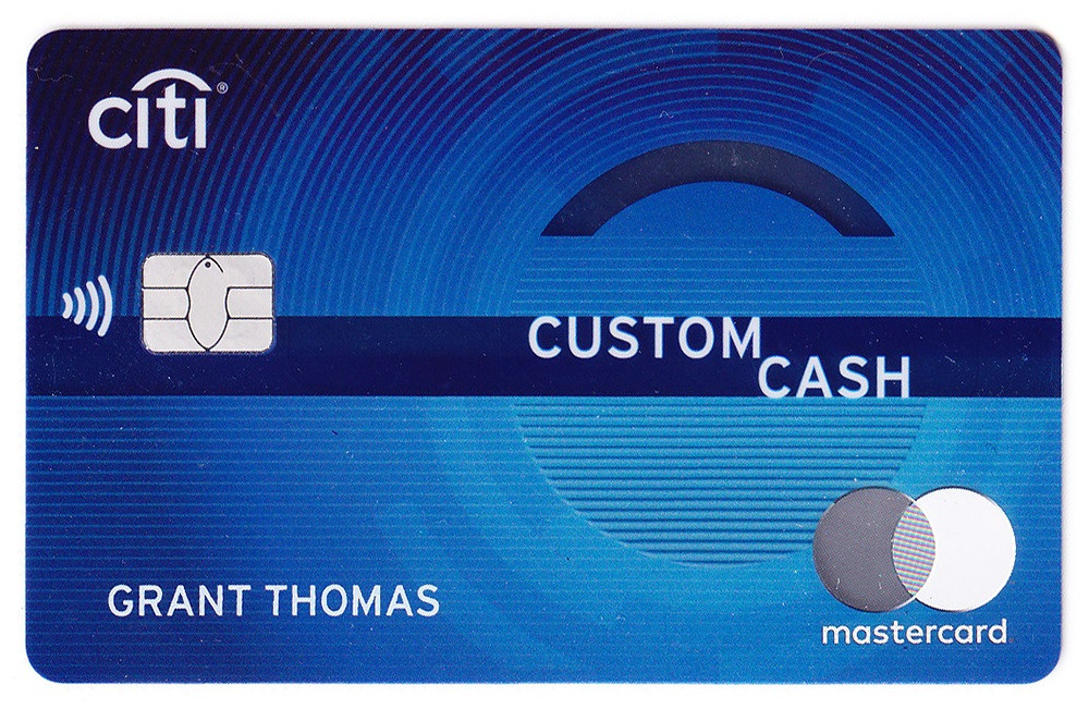 a blue credit card with a white and blue design