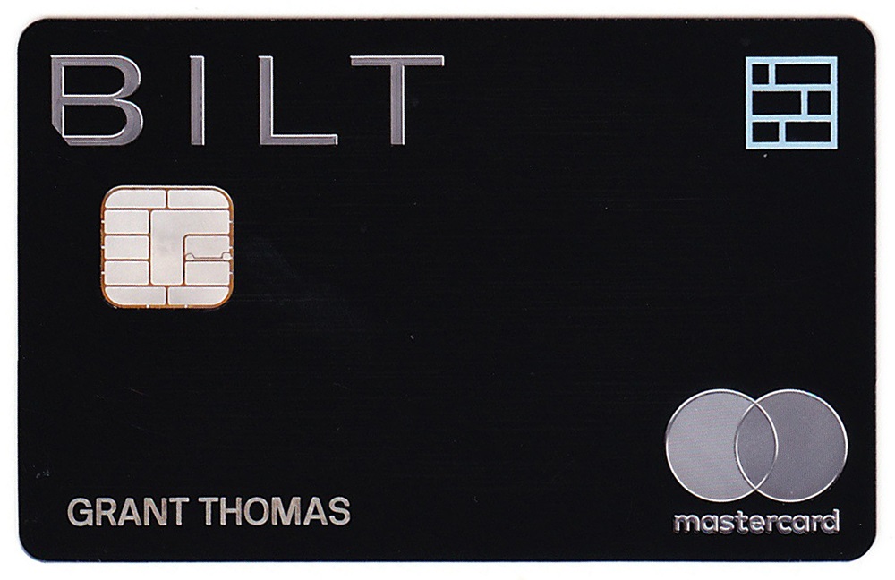 a black credit card with silver and silver text