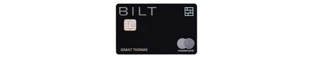 a black credit card with silver text